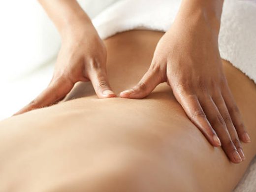 Hands massaging lower back. You may also like: